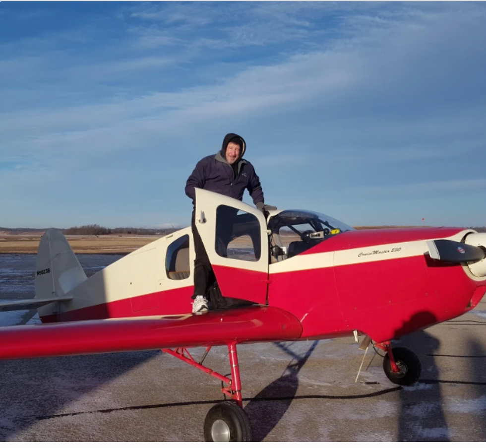 Portrait of Pete Bastien, CFI flight instructor at Bravo Flight Training, standing on an aircraft
