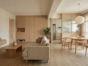 A completed home renovation in Singapore showcasing light oak cabinetry and minimal decoration, highlighting the functional simplicity of a Japandi interior design.