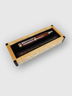 Handcrafted wooden award box with engraved “Alkense Award” pen inside.