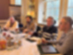 Four board members sitting around the table discussing superyacht life topics