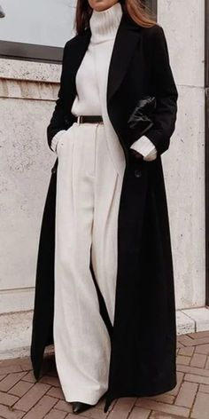 Winter Old Money Aesthetic Outfit, Outerwear, Black trench Coat, White coat, White sweater, Brown Belt, White slacks, Concreate wall, fall and winter fashion 2023