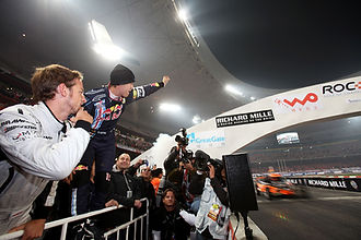 News_Jenson Button looks on as Sebastian