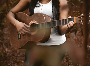 Girl Playing Acoustic Guitar, clicking this image will take you to the acoustic guitar page