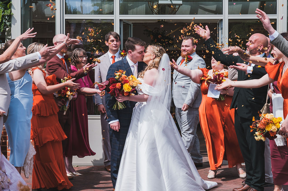 A wedding confetti shot oustide of a ceremony room