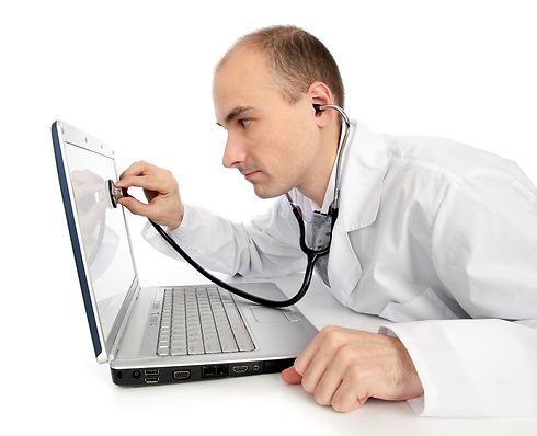 Doctor with stethoscope fixing laptop.jp