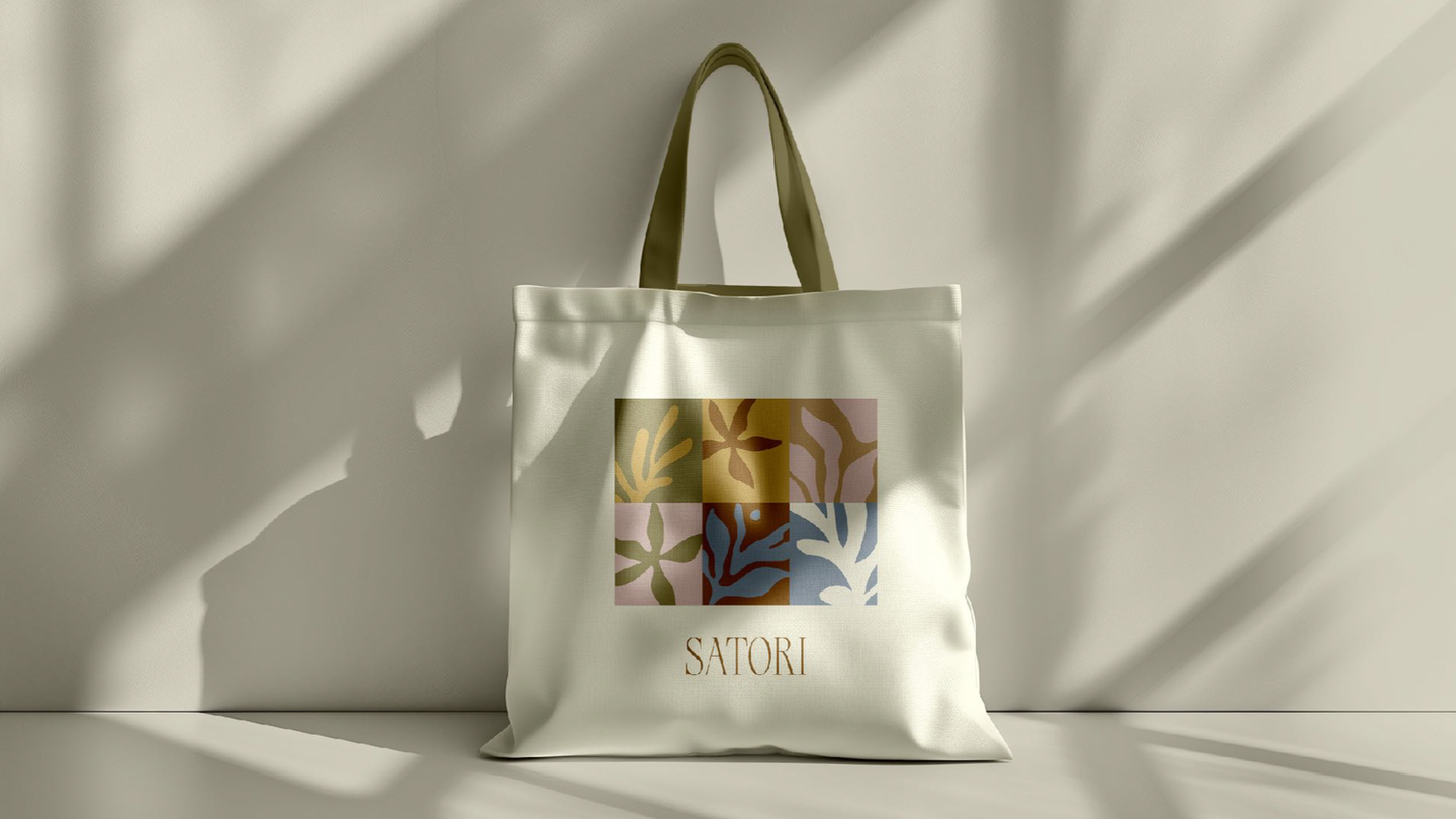 White tote bag with Satori Living branding, holistic lifestyle brand design.