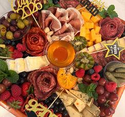 Large graduation charcuterie board with artisan cheese, cured meats, and Class of 2025 celebration decorations in NJ