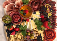 Large graduation charcuterie board with artisan selections for celebration in Marlboro Monmouth County NJ