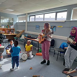 sara music therapist playing with more children
