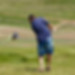 Golf course man swinging club