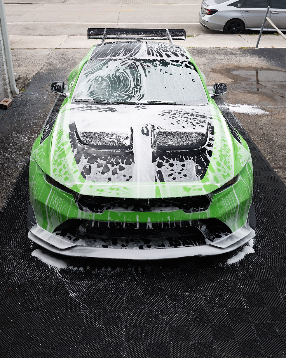 Green Ford Mustang GTD protected with full PPF coverage including exposed carbon fiber components in Miami