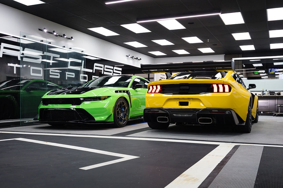 Two Ford Mustang GTDs side by side at First Class Autosports during full body PPF installation