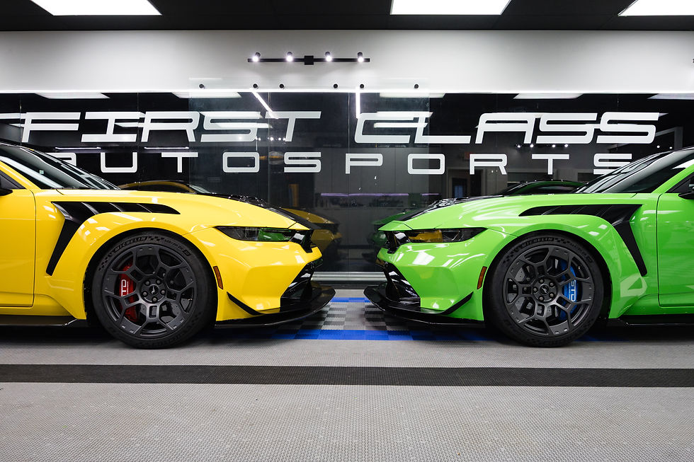 Yellow Ford Mustang GTD receiving full body paint protection film installation at First Class Autosports in Miami