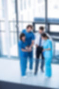 surgeons-doctor-nurse-having-discussion-min.jpg