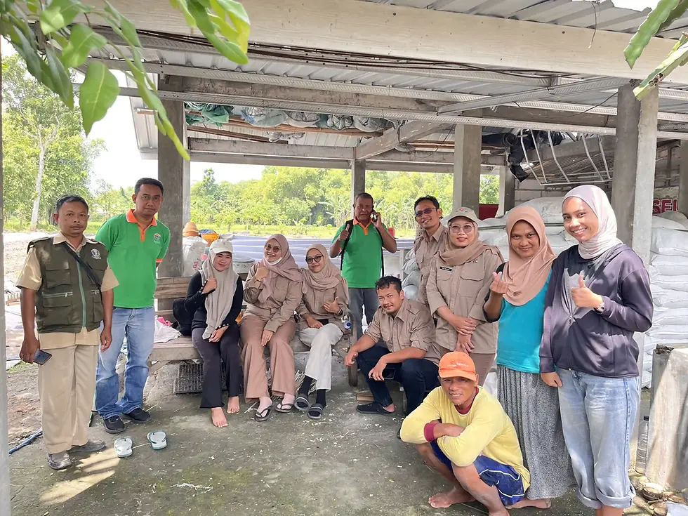 WasteX's team, Virga (far right), with local farmers and agricultural extension officers