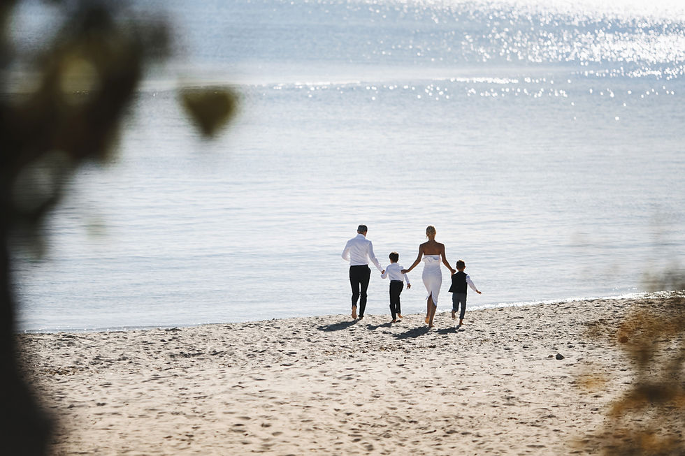 Family enjoying Marbella beach at sunset — peaceful lifestyle and relocation destination on the Costa del Sol