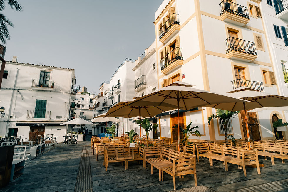 Old Town Marbella street with traditional white Andalusian houses and outdoor cafés — authentic Costa del Sol lifestyle