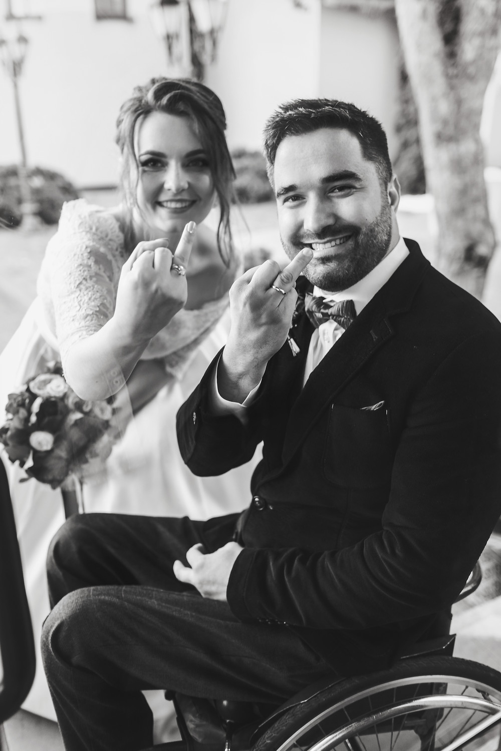 Bride and groom show off rings
