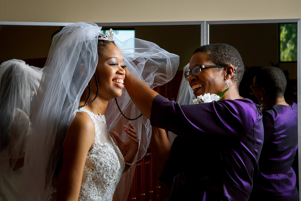 Bride and her mum getting ready for wedding