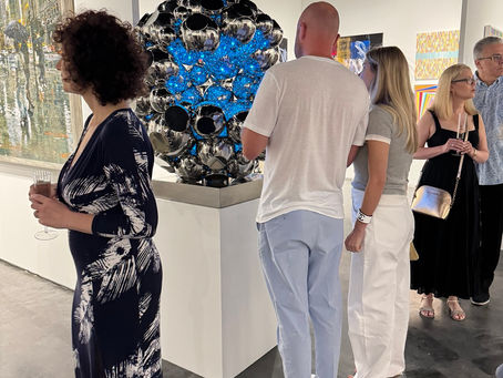 people visiting the art show