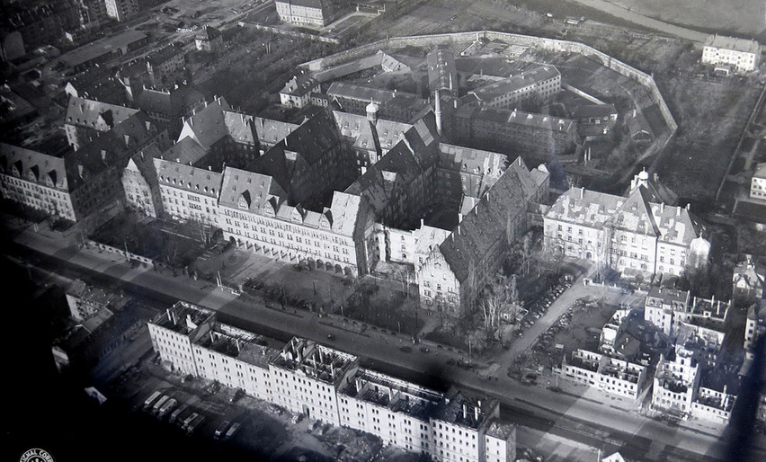 The Palace of Justice office complex with attached court building (right, Courtroom 600 on 3rd floor). Jail behind building complex in star pattern, 4 wings with half-circle fence surrounding