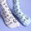 Thumbnail: Mismatched willy socks: one sock lilac, one sock blue