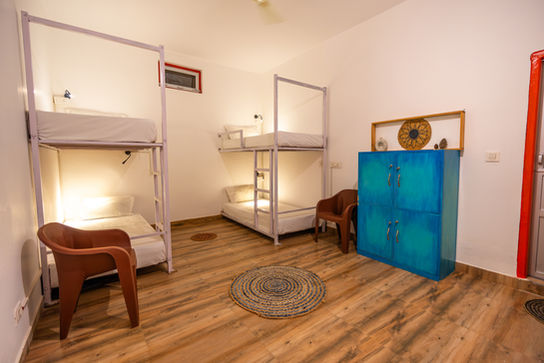 Bunkbeds at Earth Homes Bir, cozy and welcoming, warm daylight ambiance, inviting indoor lighting, vibrant colors, comfortable design, serene environment, relaxing stay, modern bunkbed setup, aesthetic interiors, harmonious lighting, charming decor, functional elegance, tranquil vibes, spacious and cozy, stylish furnishings, light-filled space, rustic charm, vibrant yet soothing, unique accommodations, scenic Bir retreat, warm and inviting ambiance, artistic design, colorful and cozy, eco-friendly lodging, comfortable and chic, thoughtful details, nature-inspired design, vibrant interiors, relaxing and stylish, memorable stay experience.