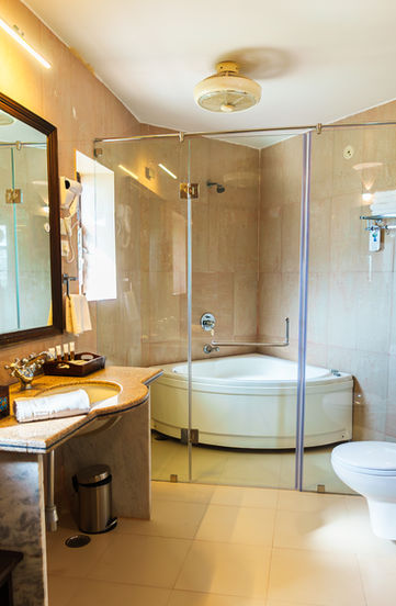 Washroom, Clarks Exotica Rajasthan, modern interiors, elegant design, minimalist style, luxury washroom, contemporary aesthetics, premium fittings, spacious layout, sleek fixtures, serene ambiance, sophisticated decor, high-end materials, comfort and style, refined craftsmanship, designer washroom, stylish interiors, functional elegance, pristine hygiene, well-lit space, natural tones, modern architecture, seamless design, relaxing environment, attention to detail, exclusive appeal, chic aesthetics, state-of-the-art facilities, timeless sophistication, upscale experience, serene retreat.