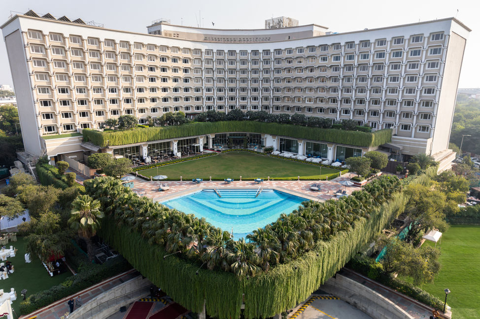 Wide Exterior Photography of Taj Palace Delhi, stunning wide-angle shots, massive luxury property, elegant exterior design, breathtaking architecture, grand and expansive views, refined and sophisticated aesthetics, iconic Delhi landmark, striking exterior photography, perfect blend of elegance and scale, capturing the grandeur, detailed property views, majestic architectural features, luxury hotel exteriors, expansive and impressive space, timeless design, premium luxury experience, magnificent outdoor spaces, captivating exterior shots, iconic Taj Palace, architectural beauty, serene surroundings, light-filled property, grandeur captured, upscale elegance, tranquil yet monumental, unforgettable first impression.