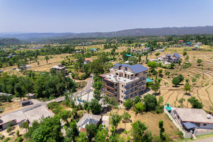 Exterior Photography of Aotel by Clarks Inn Palampur, stunning aerial shots, scenic hotel surroundings, night light views, elegant exterior design, architectural beauty, picturesque setting, Palampur hotel photography, breathtaking visuals, serene ambiance, modern structure highlights, captivating nightscape, luxurious hotel exterior, scenic landscapes, harmonious architecture, unique outdoor shots, illuminated elegance, natural surroundings, tranquil vibes, aesthetic appeal, refined design, outdoor photography, Palampur charm, artistic shots, light and shadow play, hotel exterior views, scenic captures, striking hotel design, panoramic shots, exterior beauty, visual storytelling.