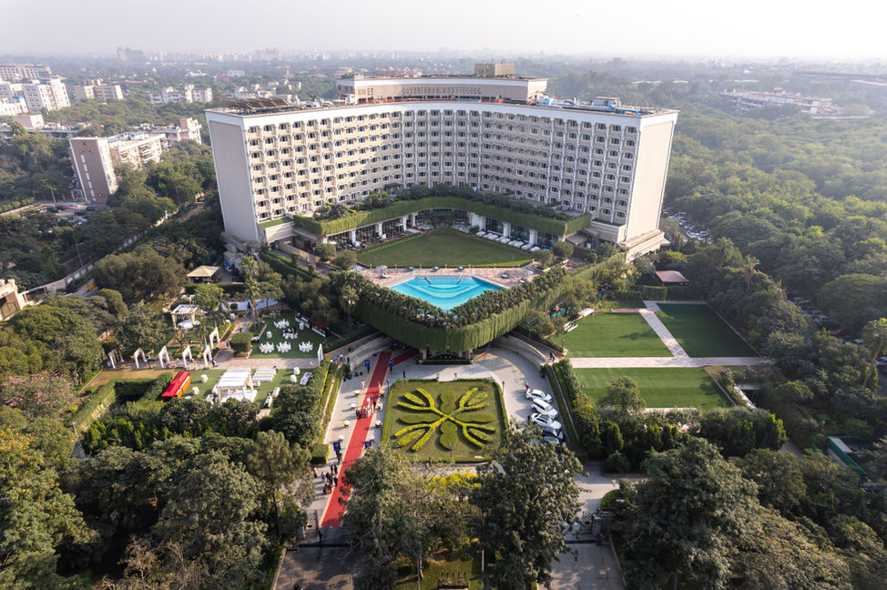 Wide Exterior Photography of Taj Palace Delhi, stunning wide-angle shots, massive luxury property, elegant exterior design, breathtaking architecture, grand and expansive views, refined and sophisticated aesthetics, iconic Delhi landmark, striking exterior photography, perfect blend of elegance and scale, capturing the grandeur, detailed property views, majestic architectural features, luxury hotel exteriors, expansive and impressive space, timeless design, premium luxury experience, magnificent outdoor spaces, captivating exterior shots, iconic Taj Palace, architectural beauty, serene surroundings, light-filled property, grandeur captured, upscale elegance, tranquil yet monumental, unforgettable first impression.