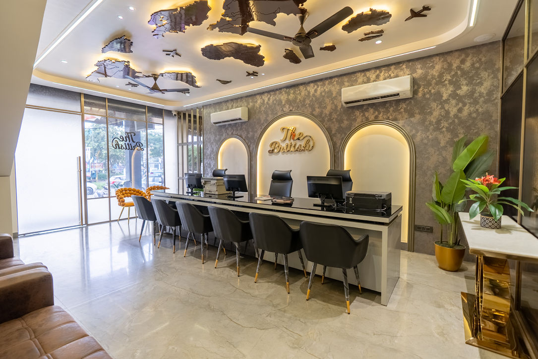 Architectural interior  photograph of "The British" office with computers and world map design on ceiling.