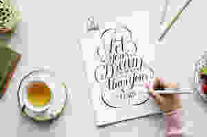 person holding white pen near white poster