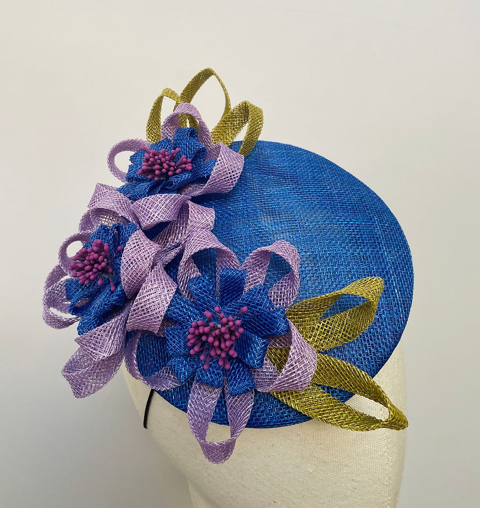 Thumbnail: Bright blue wedding hat with looped flowers and leaves displayed on a mannequin head