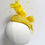 Thumbnail: A yellow feather fascinator with spot veiling and matching bow is displayed on a mannequin head
