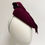 Thumbnail: A burgundy felt bow mother of the bride hat is displayed on a mannequin head