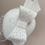 Thumbnail: Side view of retro style bridal birdcage veil displayed on a mannequin head