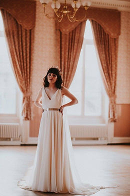 Full length view of a woman wearing a wedding dress and headpiece