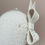 Thumbnail: Side view of retro style bow birdcage veil displayed on a mannequin head