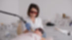 Close-up view of medical aesthetician performing laser treatment