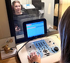 Patient in the hearing testing booth with Mandi Solat, Doctor of Audiology from Audiology Services and Hearing Aids completes a comprehensive hearing test.