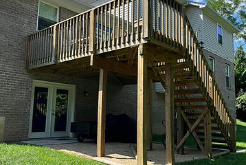 Staining restoration of a wooden deck and stairs, highlighting residential staining services by No Hassel Painting.