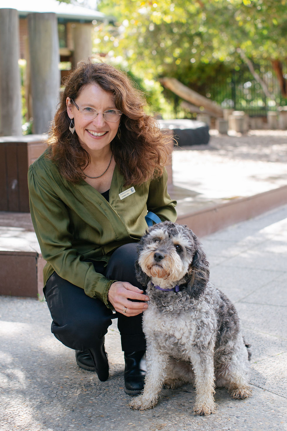 Parklands Principal, Joanna, and Parklands Wellbeing Dog, Pepper, smiling outside