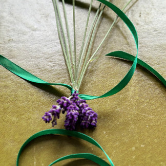 9 lavender heads tied together with thread and ribbon