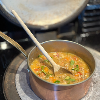 Pan of bean and pasta soup on Aga