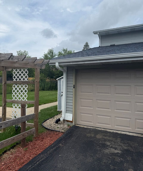 Downspout off gutter into ground drain