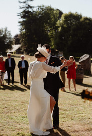 Bride and groom dancing outdoors during the wedding cocktail hour