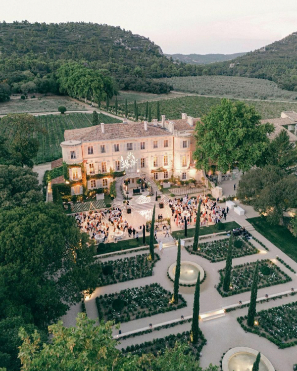 Aerial view of a luxury Provençal estate hosting an elegant wedding celebration
