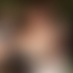 Bride and her mother embracing during live wedding music