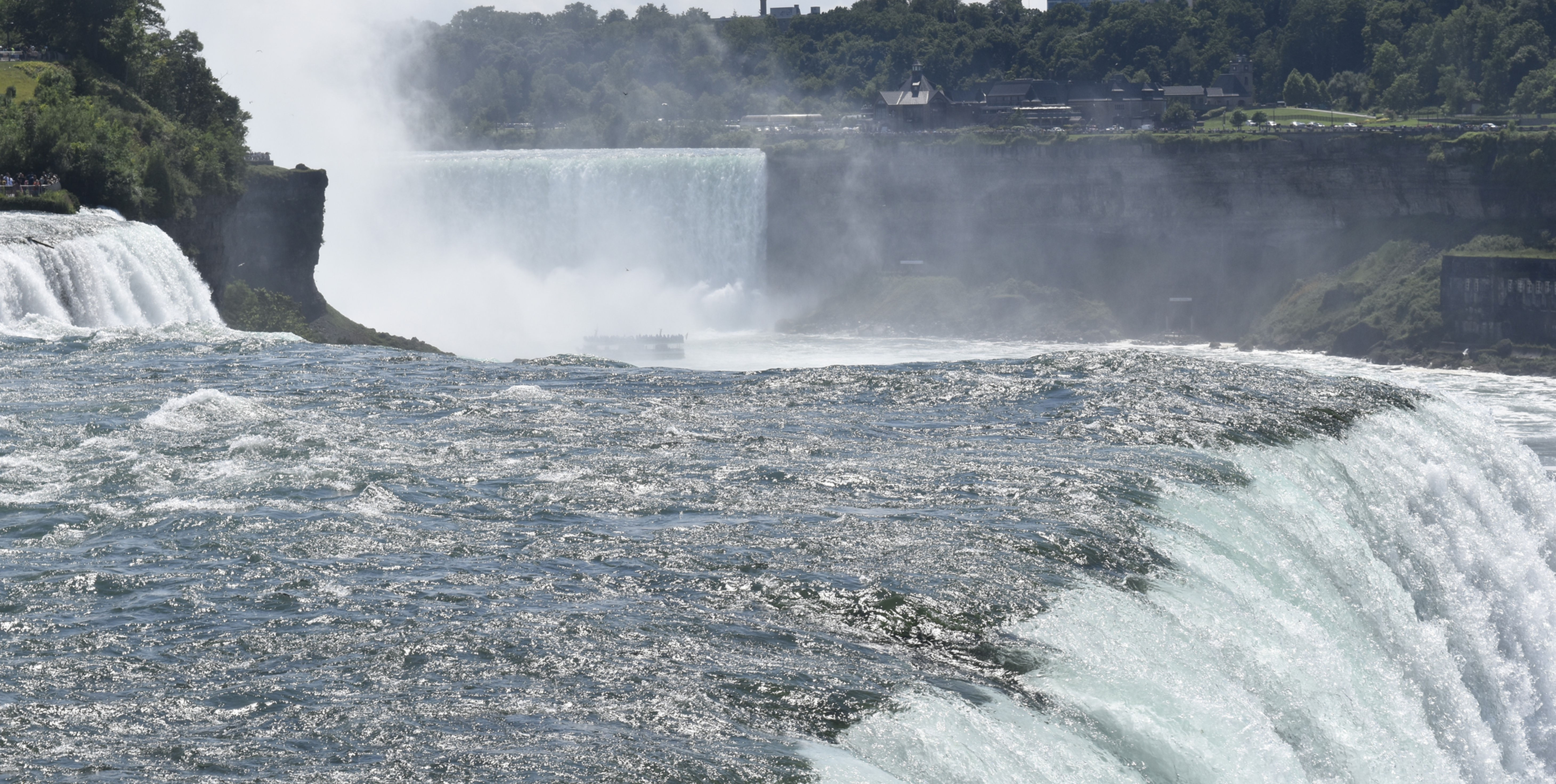 Top of American Niagara Falls with Canadian Falls in background